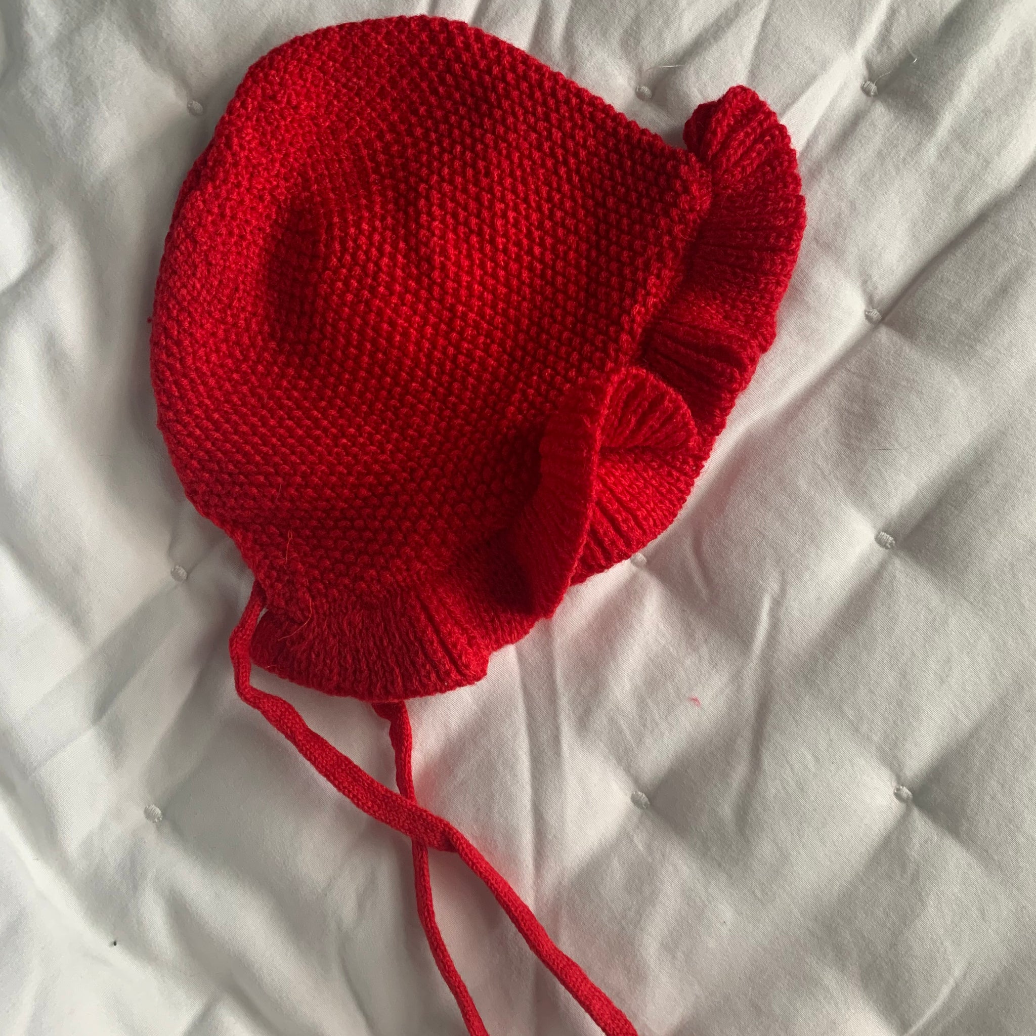Red knitted baby hat