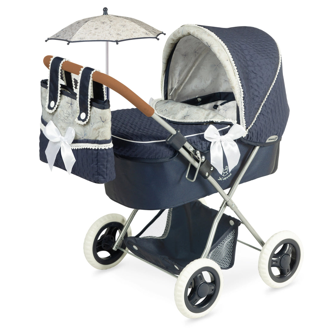 A blue and black doll stroller with a transparent bag, storage tray, and a hood with tensioners. It also shows a mattress and pillow.