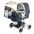 A blue and black doll stroller with a transparent bag, storage tray, and a hood with tensioners. It also shows a mattress and pillow.