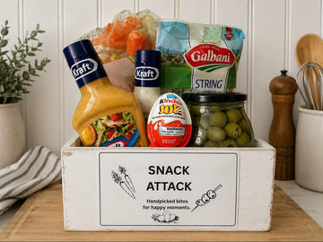 Shop the Snack Attack Gift Crate featuring organic carrots, string cheese, olives, Kinder Joy, and 2 Kraft condiments. Handpicked bites for happy moments.