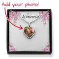 Heart-shaped photo necklace in a decorative box with cherry blossoms.